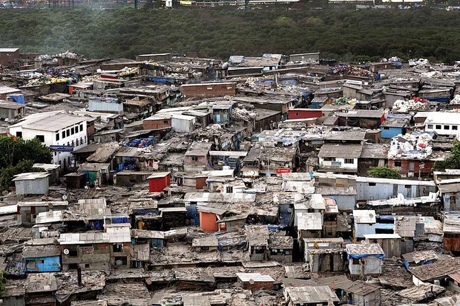 Dharavi Slum Tour in Public Transportation - Community centre stop and mixed religious life