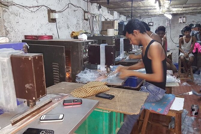 Group Tour of Dharavi Slum walk with local Guide - Work areas: leather, pottery, soap, bakery, and colour dye