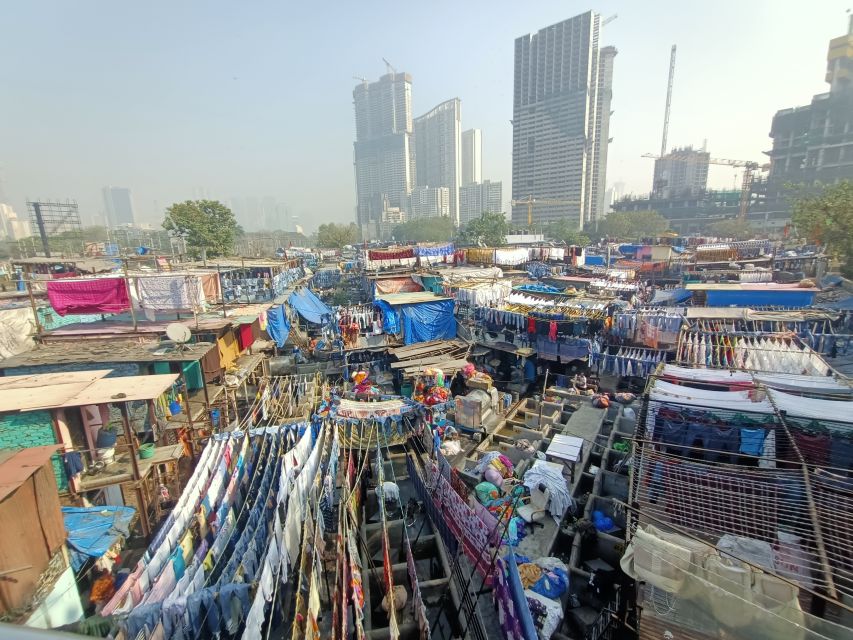Mumbai: Dhobi Ghat Tour with Dharavi and Train Ride Options - Mahalaxmi Dhobi Ghat On Foot: What You’ll See Up Close